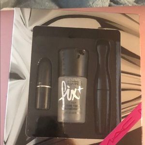 Mac kit with primer, lipstick, and mascara